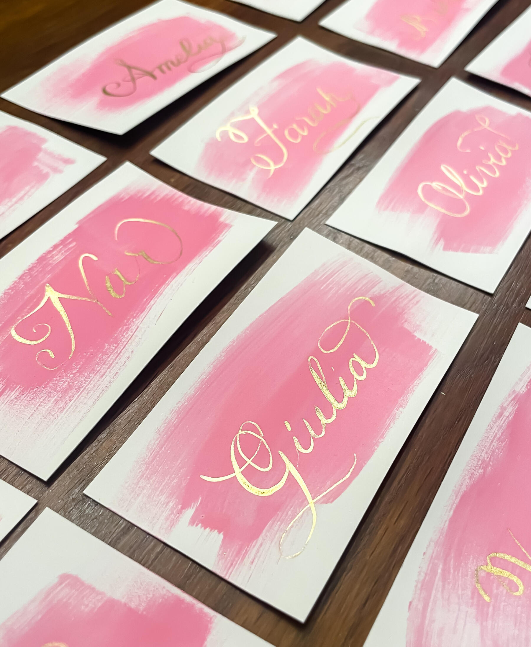 - Handwritten calligraphy place cards for events in Montréal. - Calligraphy place cards with guest names, created by Lilies & Inks. - Black ink handwritten name cards for weddings and dinners.